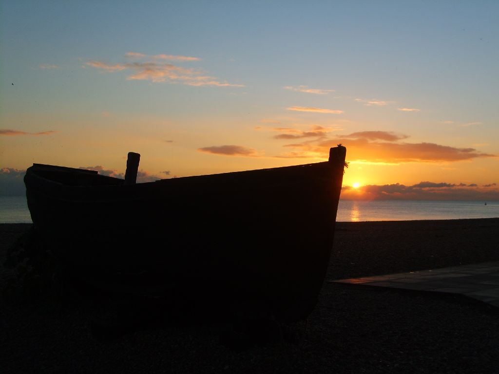 Travel Photo Roulette: Silhouette of a fishing boat from Brighton, England, CA pier. Copyright by globetrottergirls.com