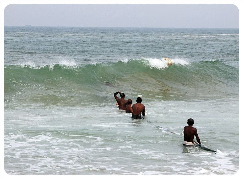 Fishermen in the waves